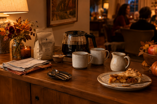 After-dinner decaf coffee station with mugs, ground coffee, milk, and apple pie in a cozy fall home