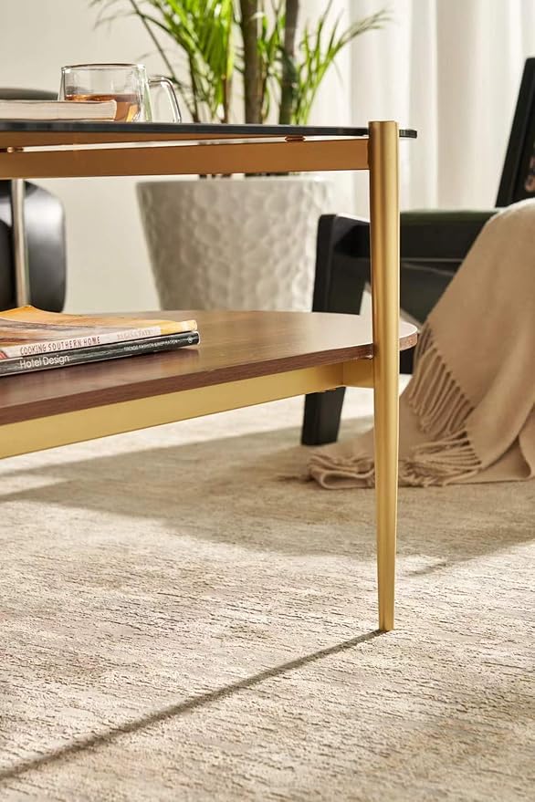Shrine Oval Coffee Table, Mid-Century Modern Design, 2-Tier Structure, Amber Glass Top and Walnut MDF Shelf, 47" D x 21" W x 17" H, Sleek Conical Metal Legs with Gold Finish