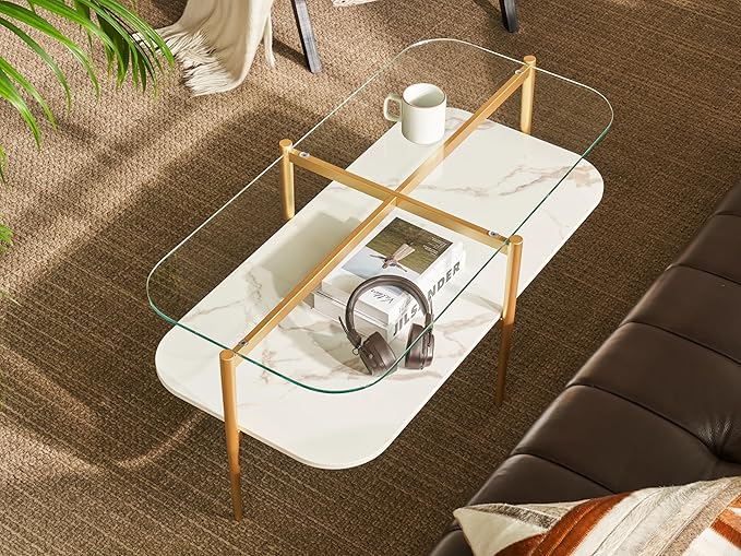 Shrine Oval Coffee Table, Mid-Century Modern Design, 2-Tier Structure, Clear Glass Top and White MDF Shelf, 41" D x 21" W x 17" H, Sleek Conical Metal Legs with Gold Finish
